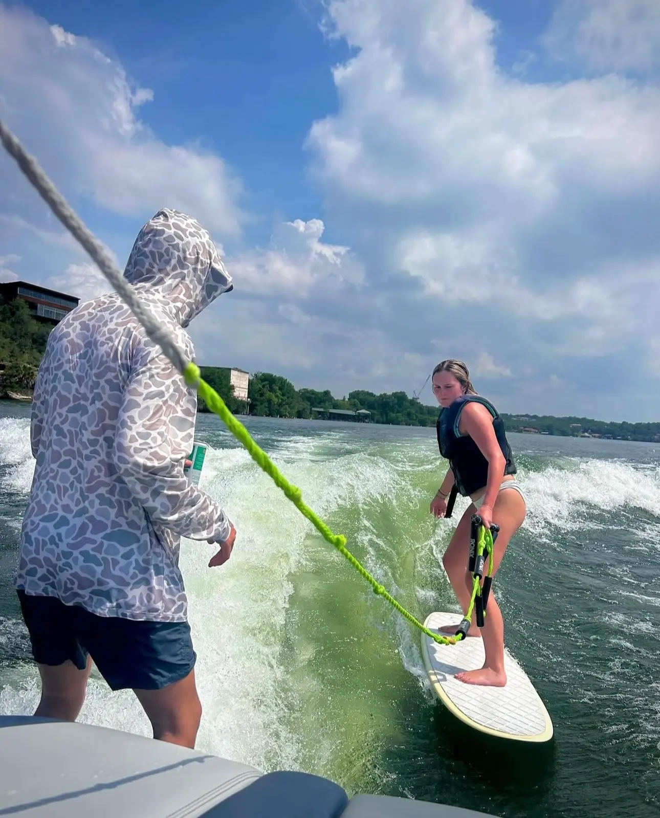 Group on a pontoon on Lake Austin with coolers and gear